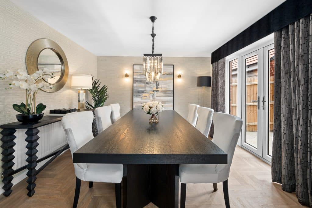 Contemporary dining room with black table and white chairs
