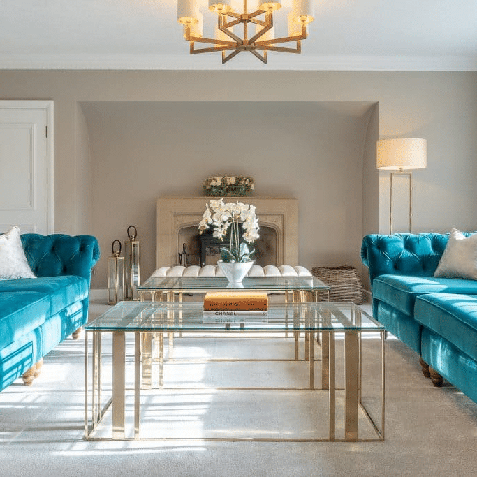 Aqua Sofas and Glass Table Living Room